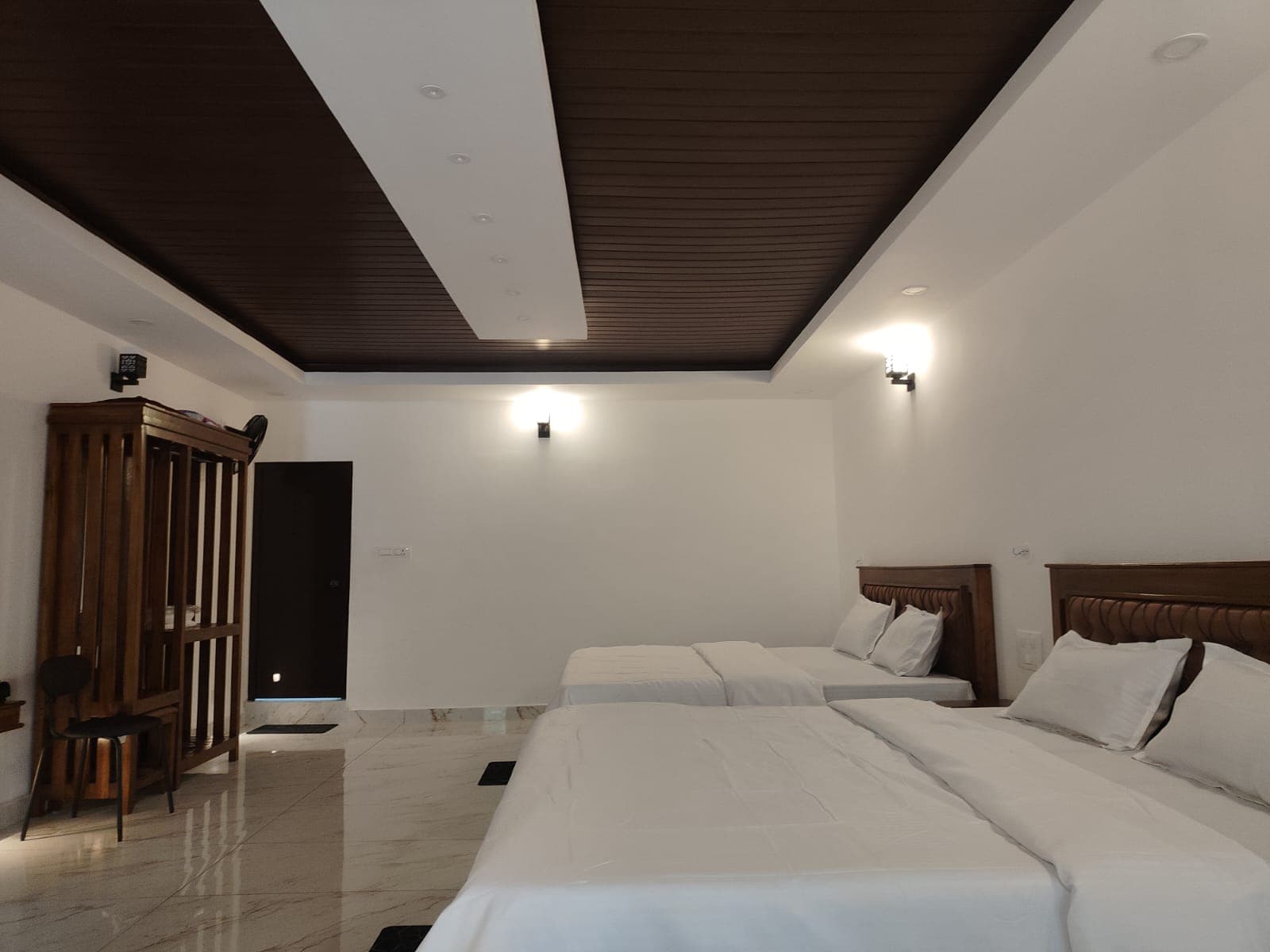 Twin bedroom with warm wooden furnishings
