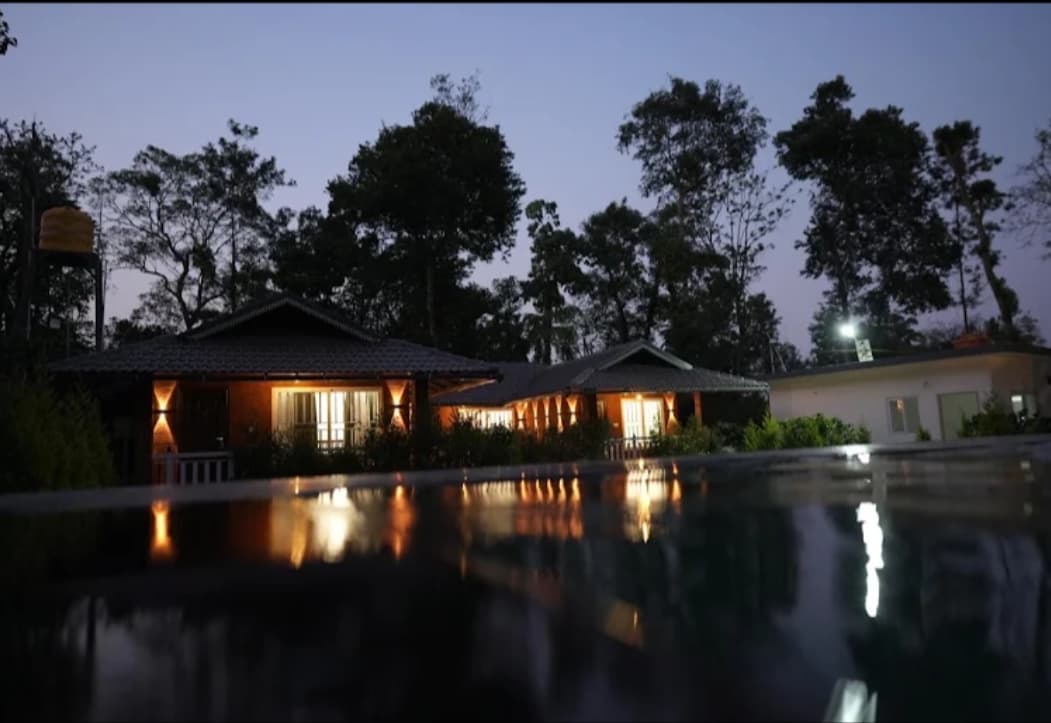 Mistora Estate Villa's cottages and pool at dusk