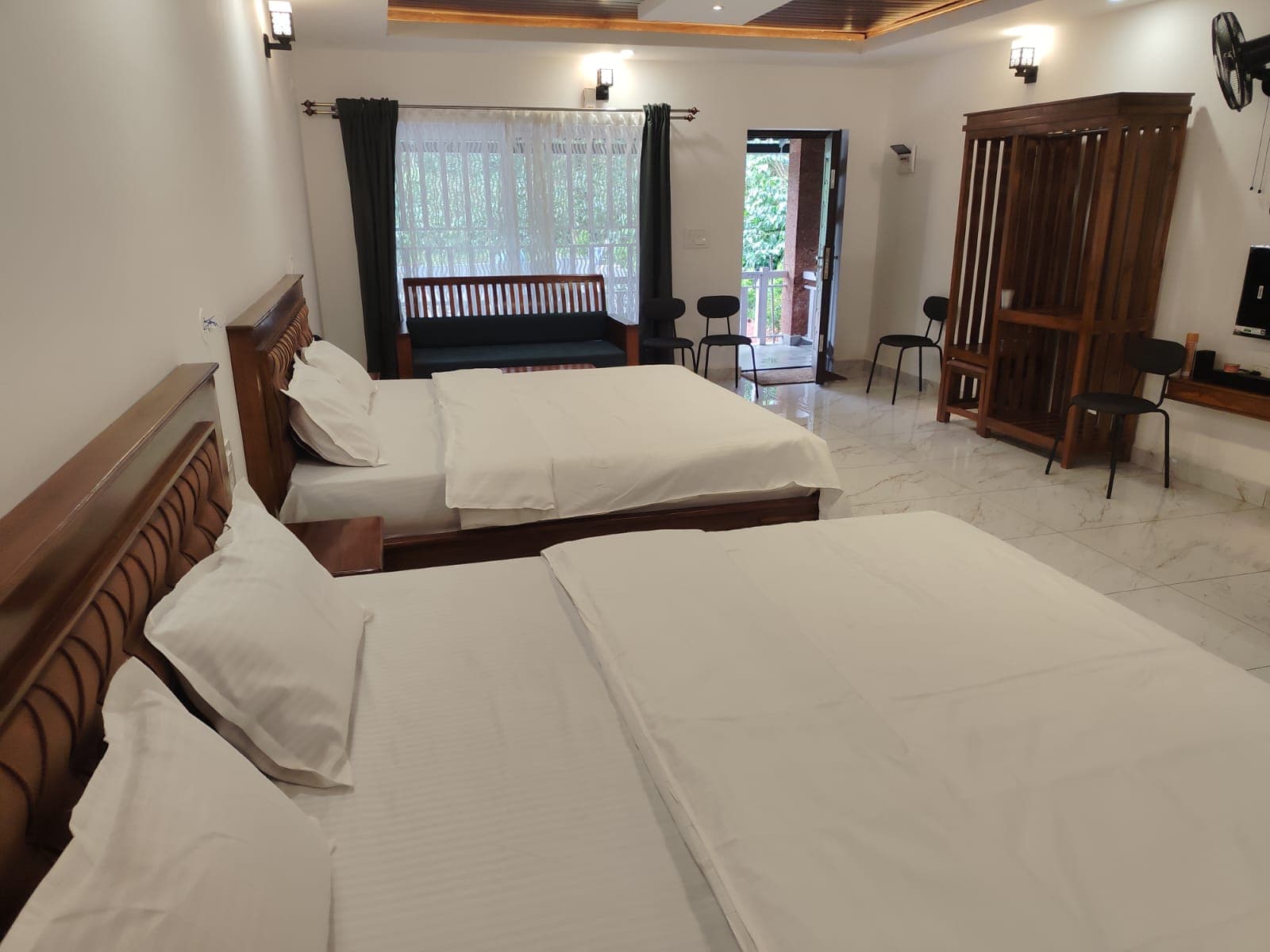 Family suite with twin beds and private balcony at Mistora Estate Villa