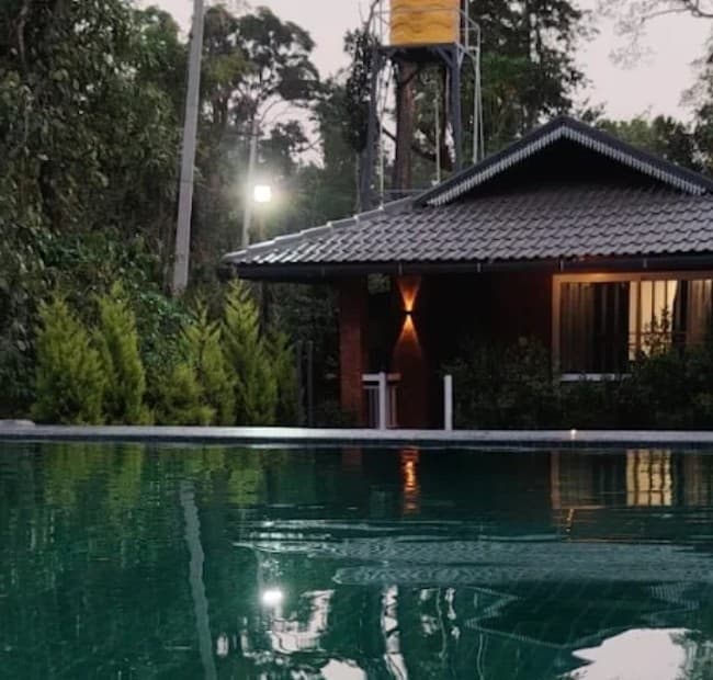 Mistora Estate Villa's cottage and pool reflection at dusk